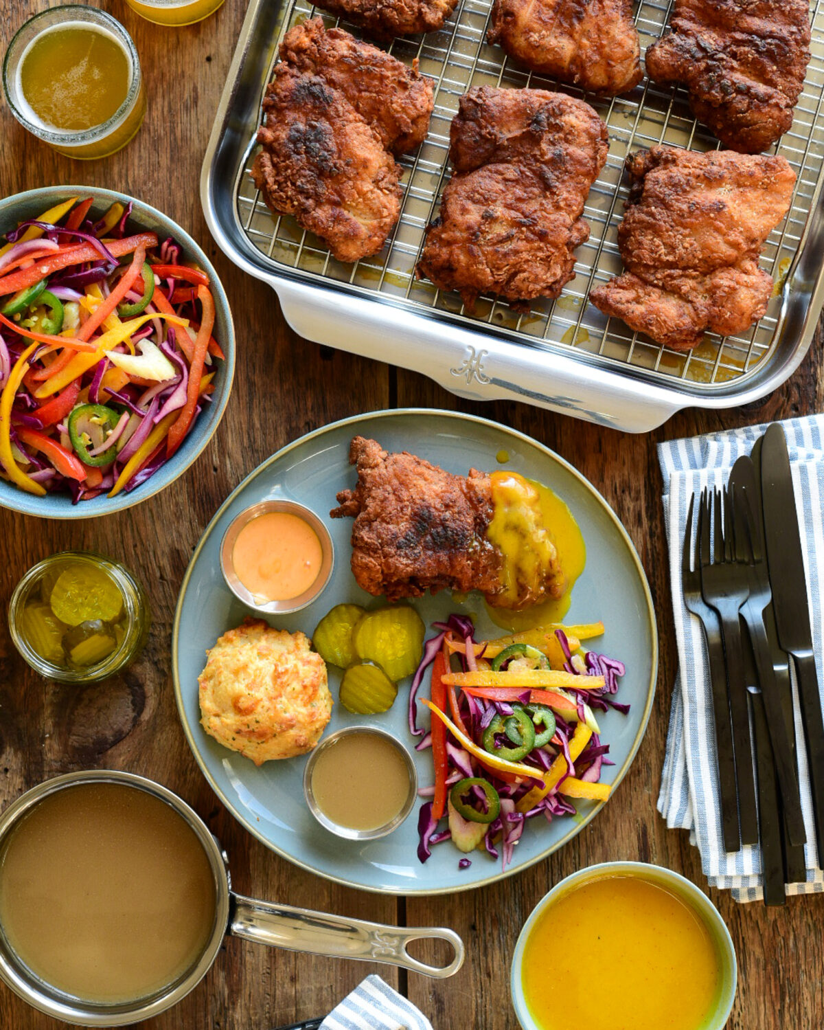 Spicy Buttermilk Fried Chicken served with three dipping sauces, slaw and cheddar biscuits.