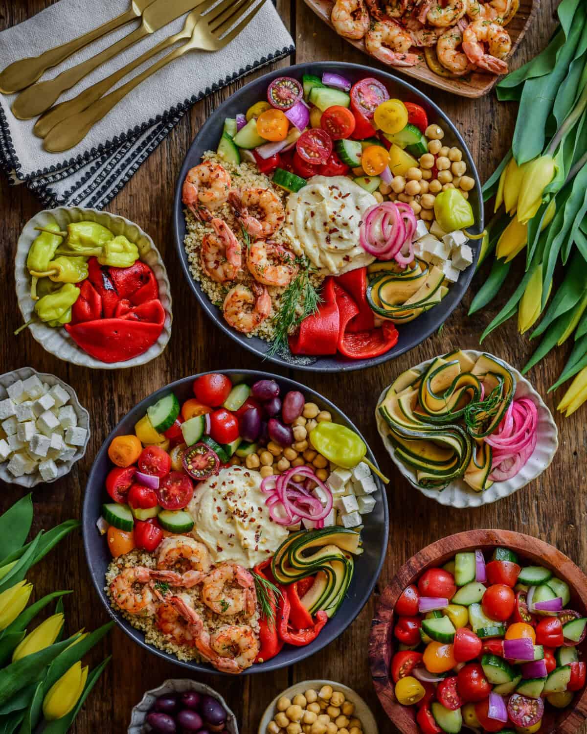 Sheet Pan Lemon Garlic Shrimp Bowls served with extra toppings on the side.