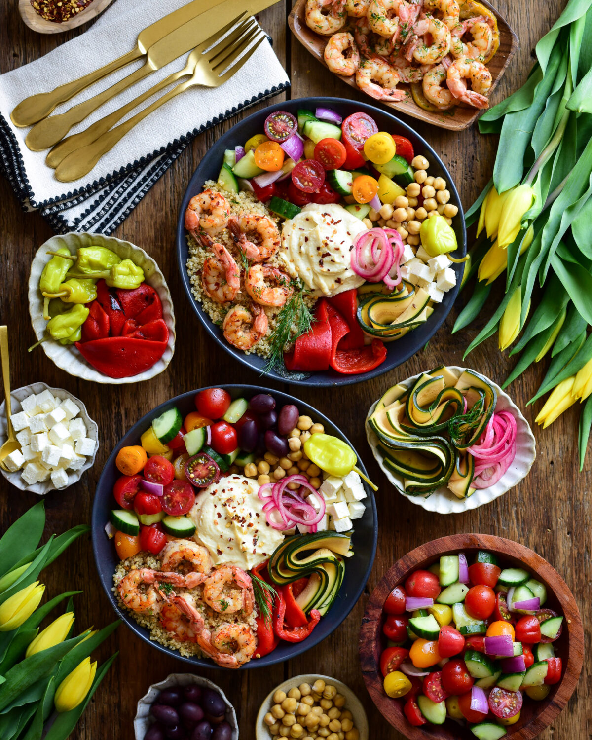 Sheet Pan Lemon Garlic Shrimp Bowls served with extra toppings on the side.