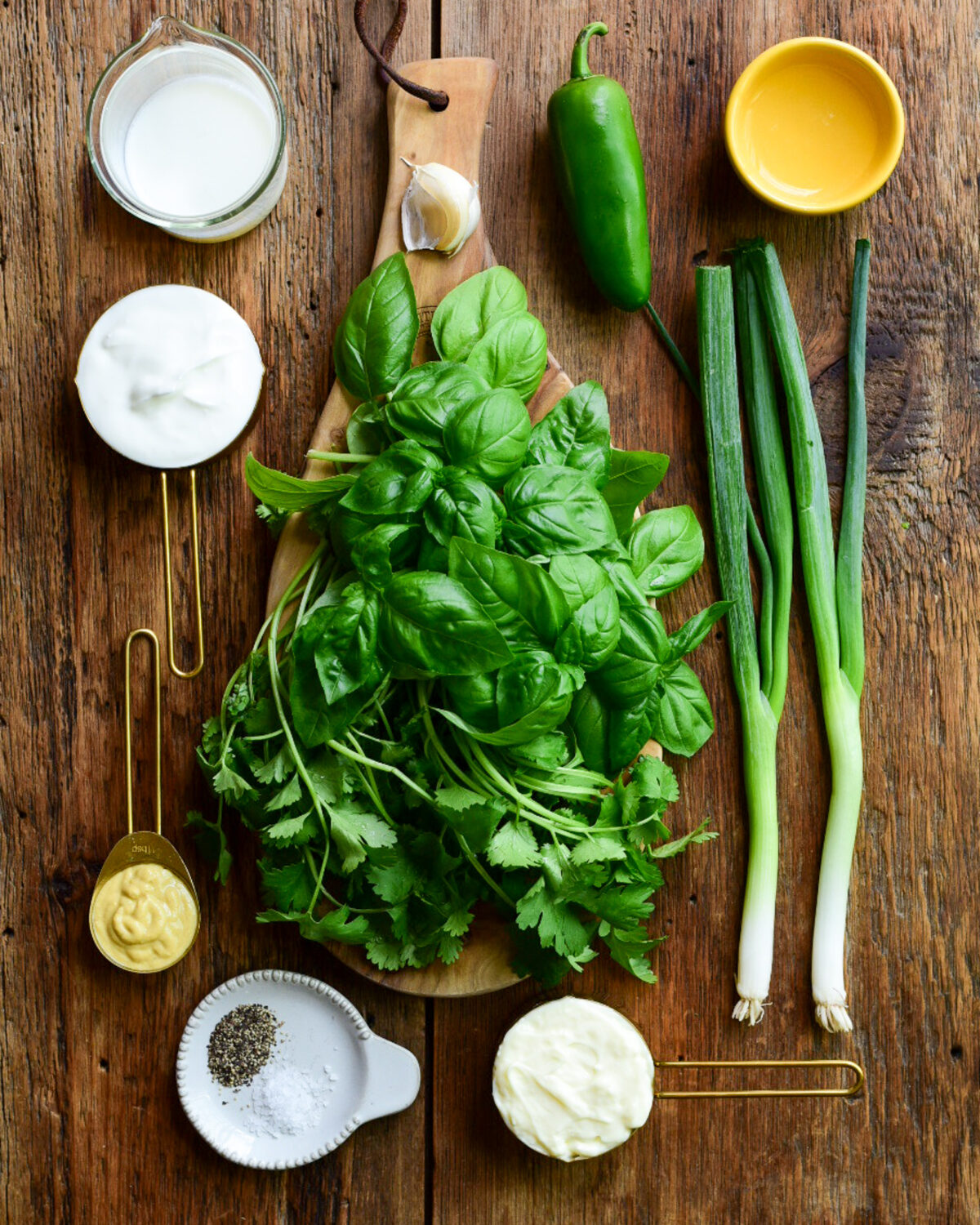 Ingredients for a buttermilk-herb dressing recipe.