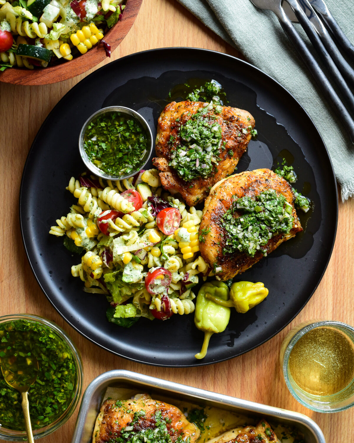 Air Fryer Chicken Thighs with Chimichurri served with BLT pasta salad.