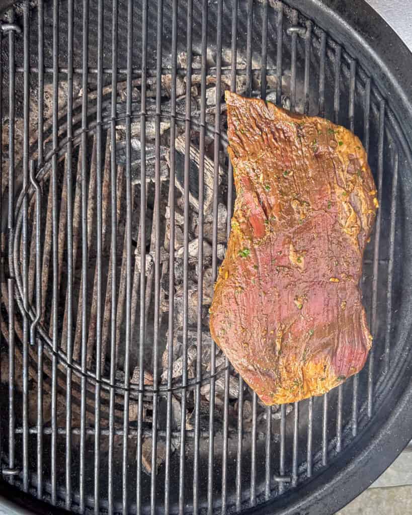 Place the flank steak directly over the direct heat.