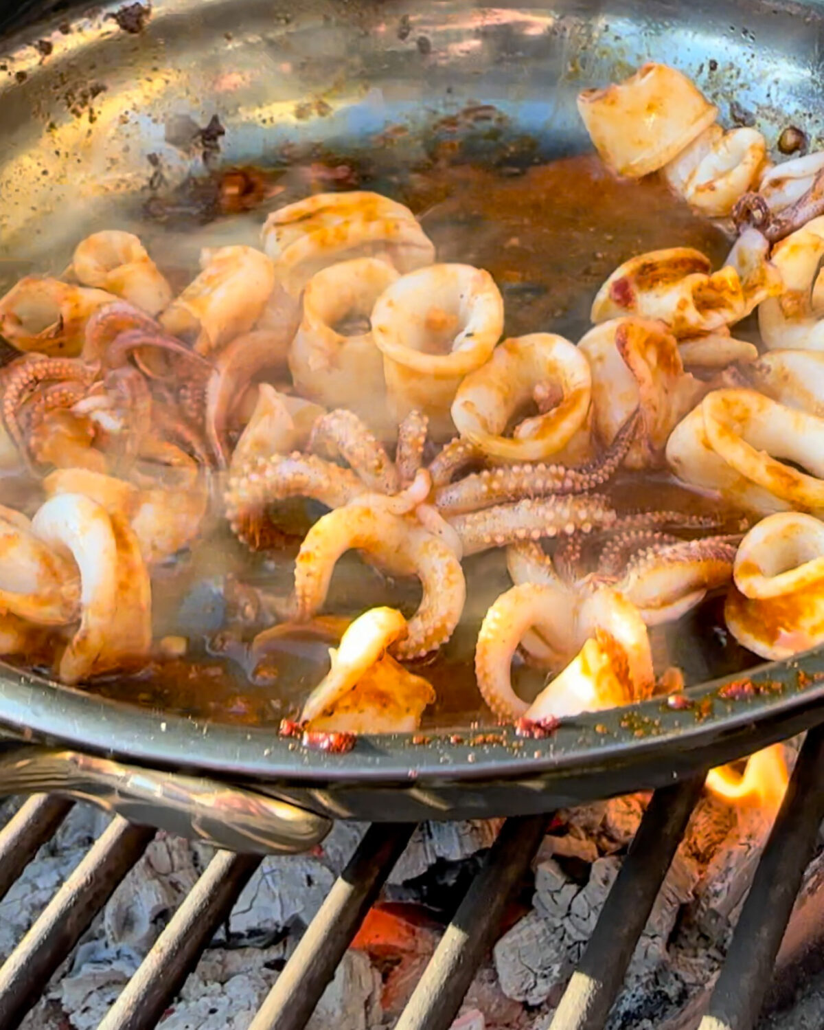 Add the baby squid to the skillet and cook until they turn opaque and curl up.
