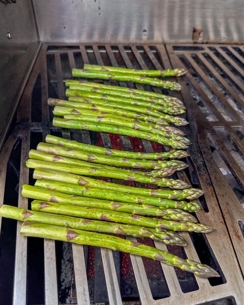 Asparagus getting grilled.