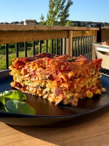 A side view of a piece of lasagna showing the layers.