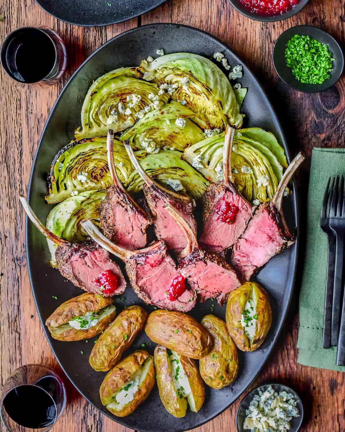 Grilled venison rib rack served with grilled cabbage and tender baked potatoes