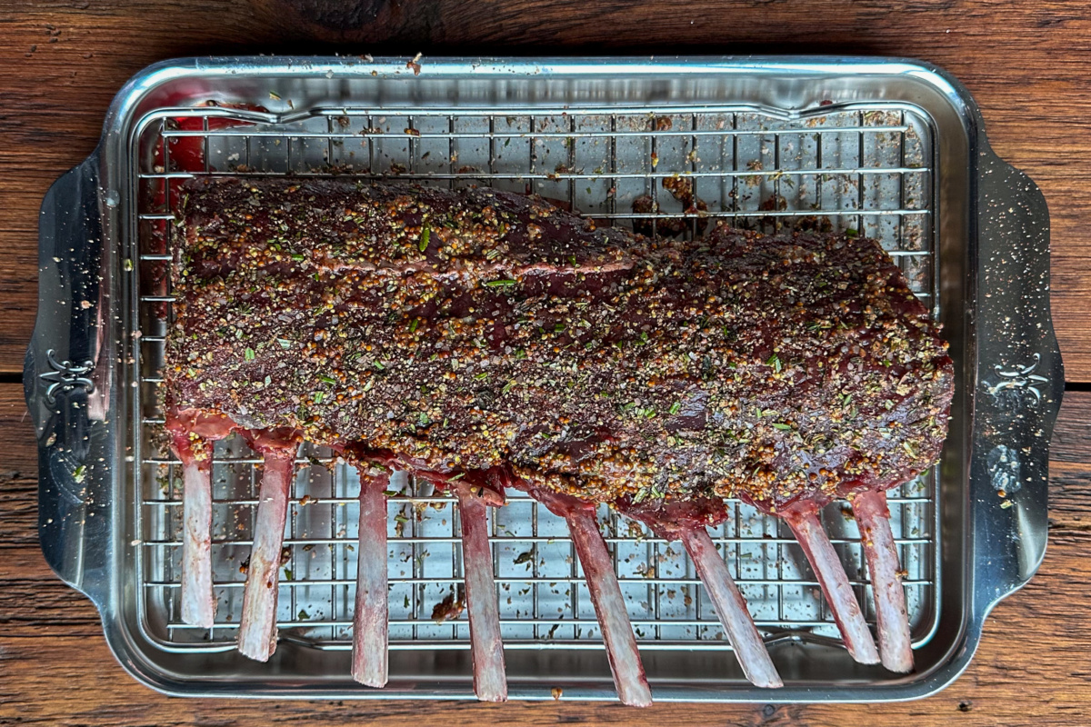 Prepped and seasoned venison ready for grilling.