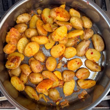 Bomba Potatoes in a skillet.
