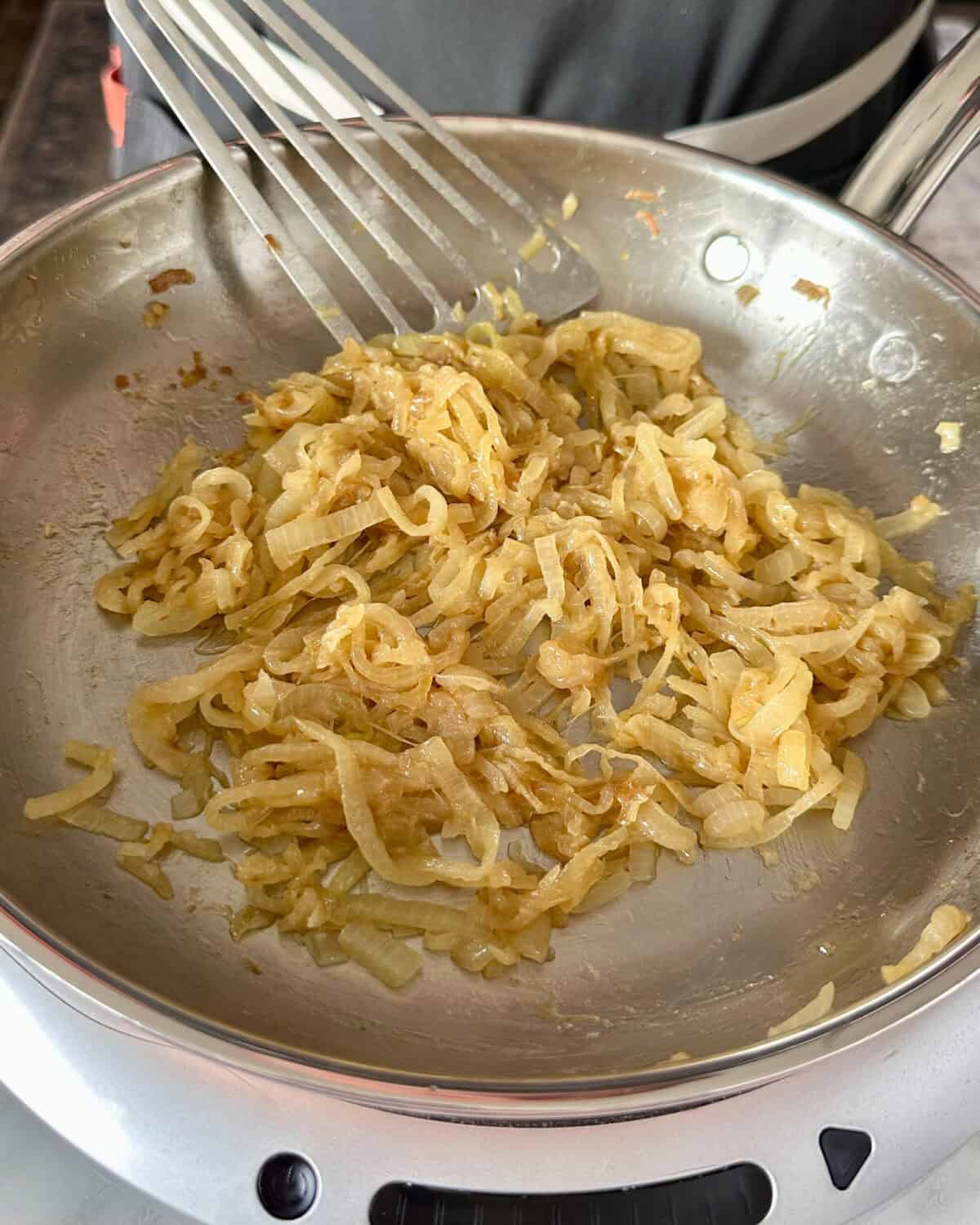 Irish Whiskey Caramelized Onions in a pan for Guinness Mac and Cheese.