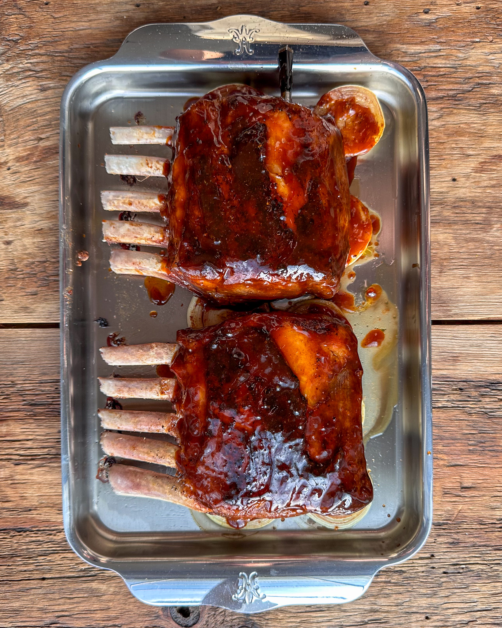 Return the seared racks to the onions. Generously brush with the sticky sauce.