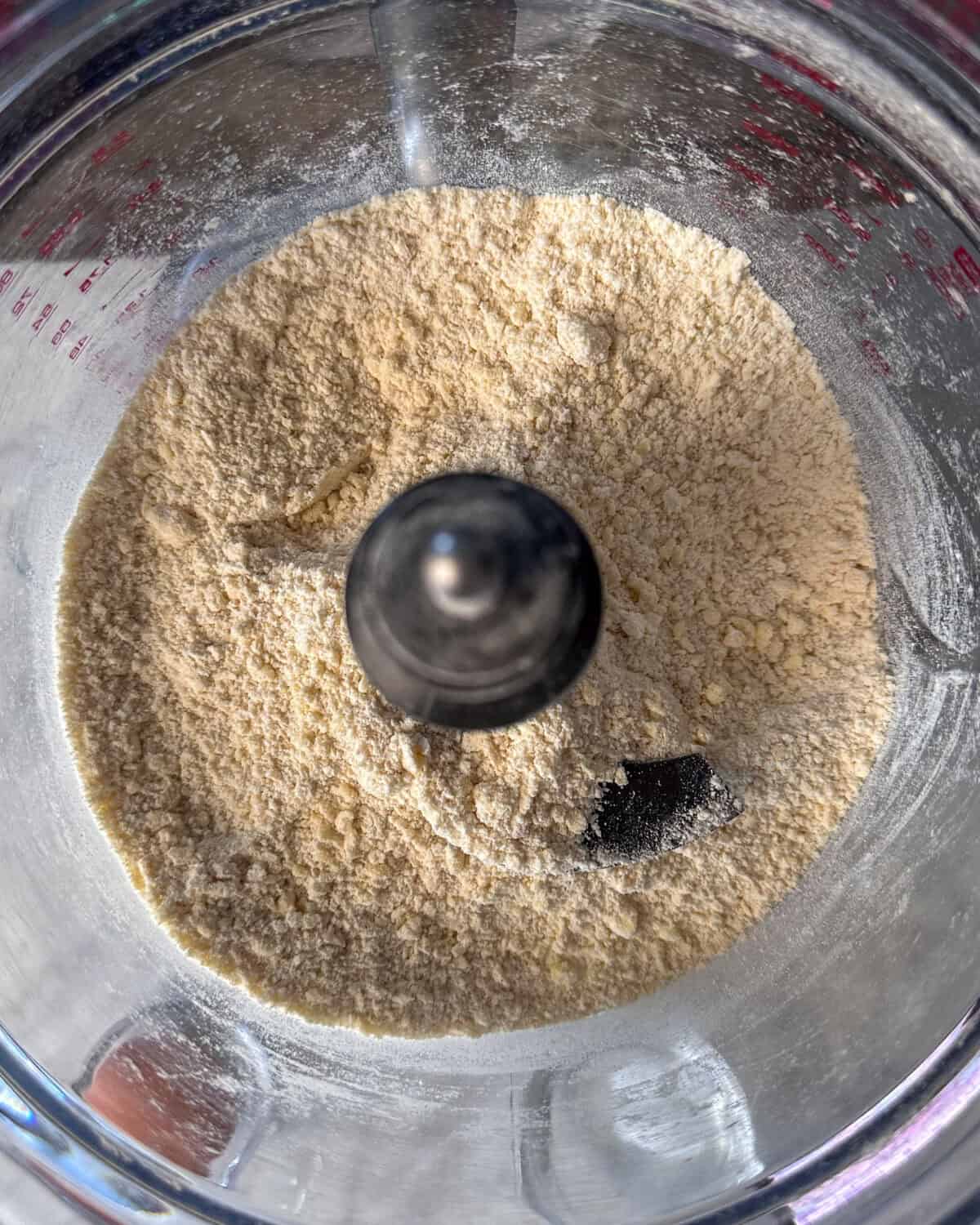 Pulse the flour with the cold butter until it resembles coarse crumbs.