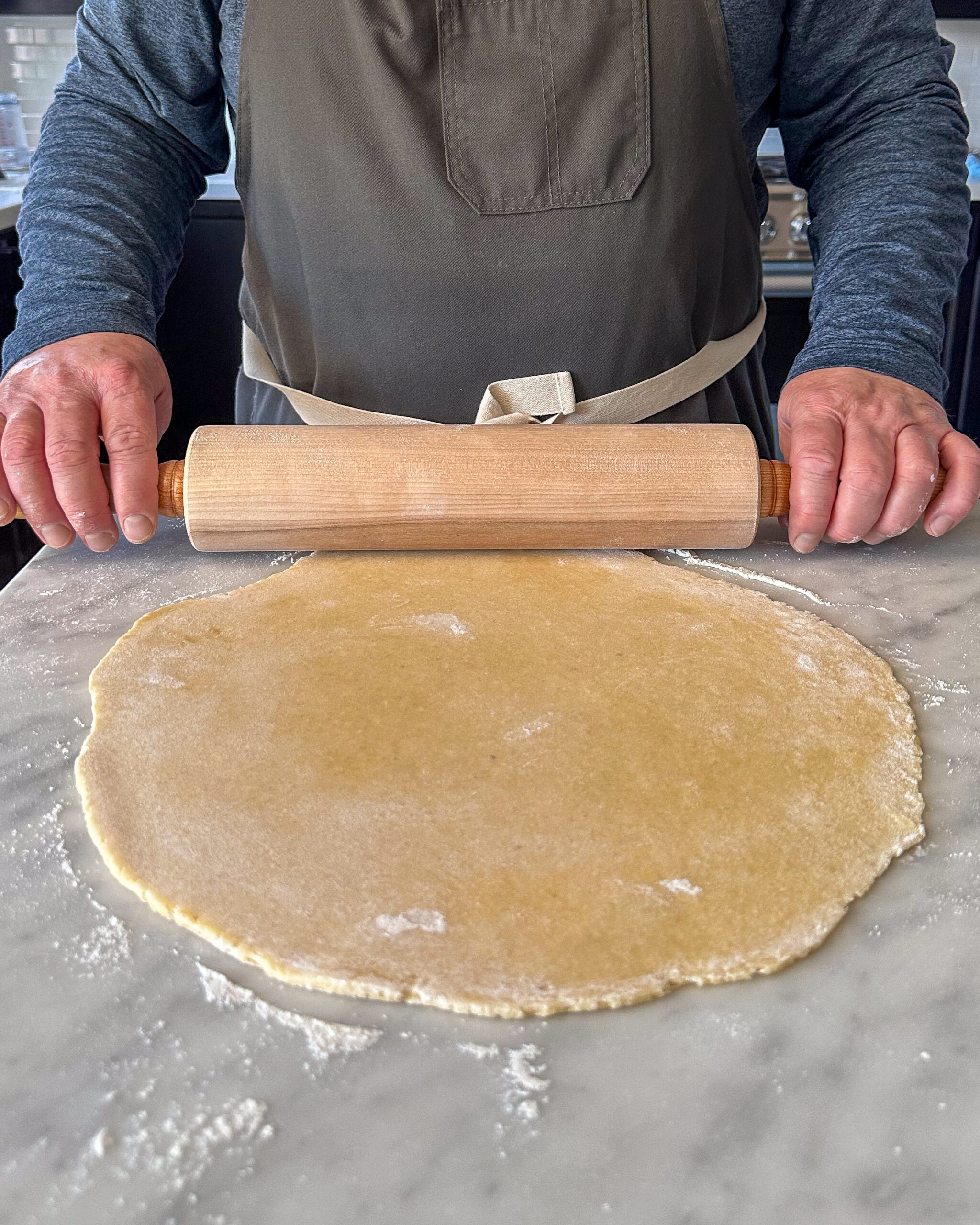 Roll the quiche dough into a 13-inch circle (about ¼ inch thick).