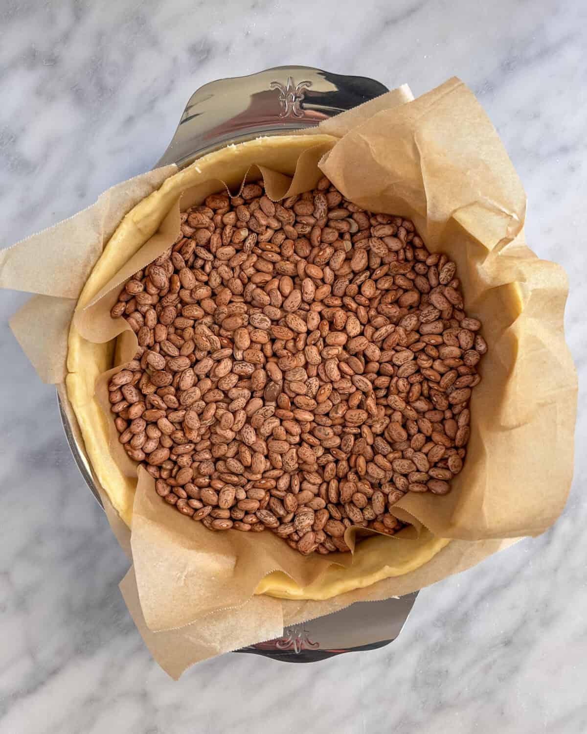 Blind bake the quiche crust with pie weights or beans.