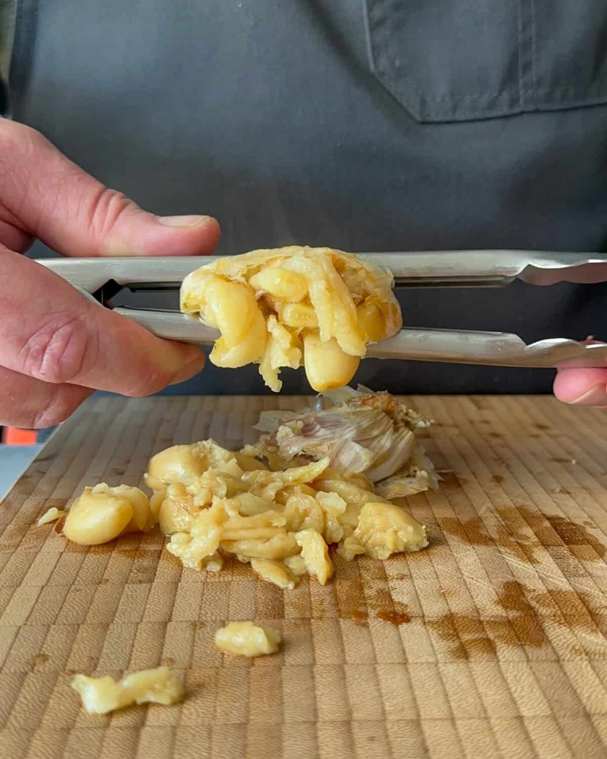Squeeze the roasted garlic out of the skins onto a cutting board.