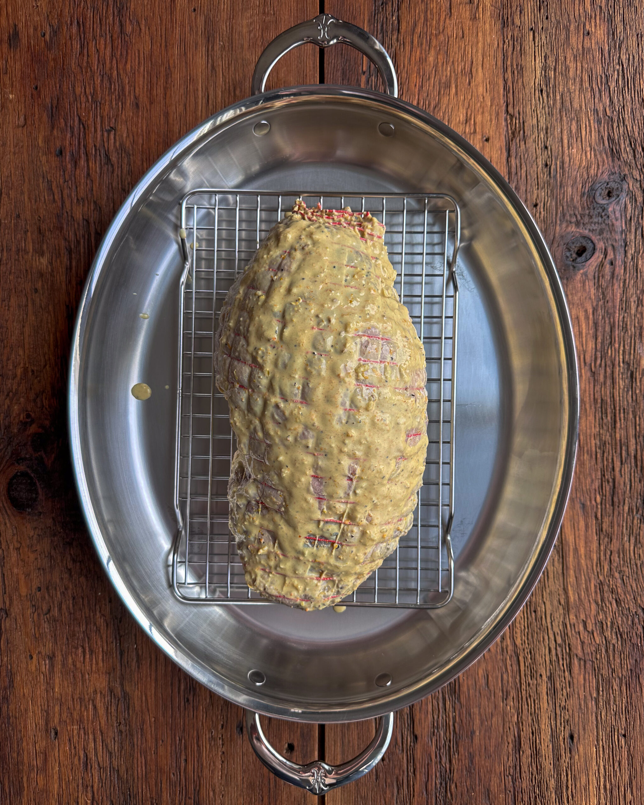 Place lamb on a wire rack over a roasting pan and discard any excess marinade.