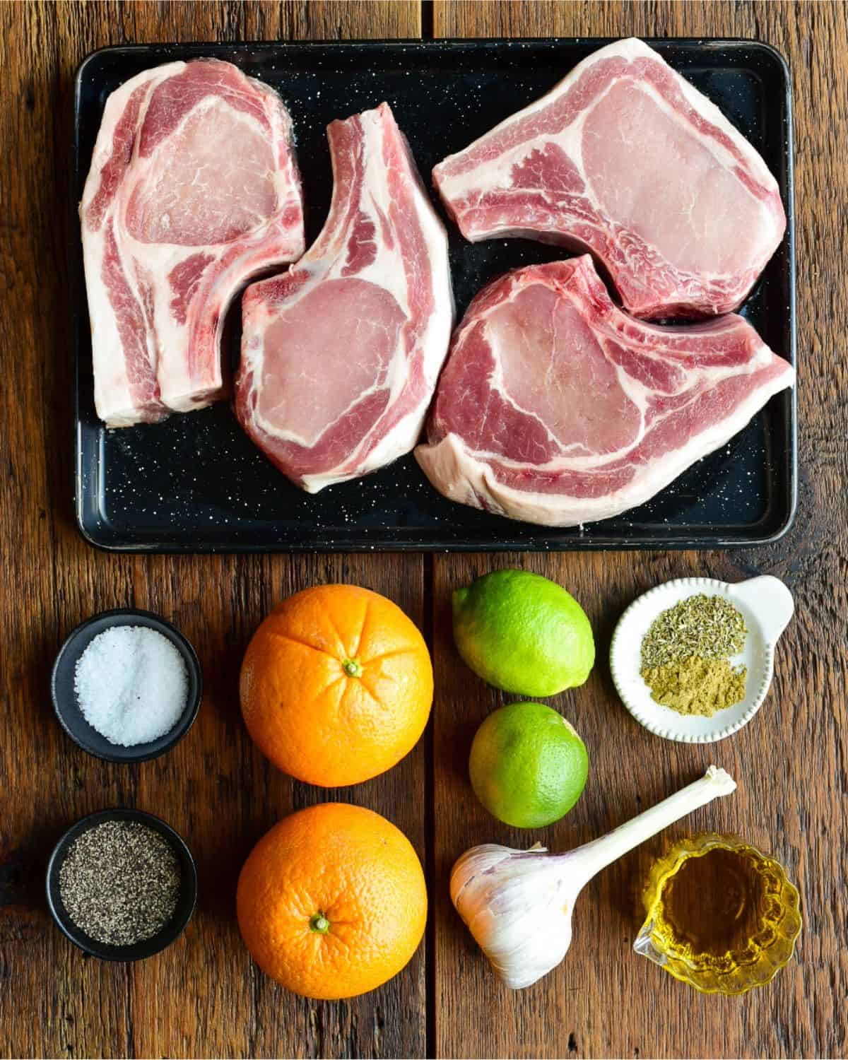 Ingredients for reverse seared pork chops with a mojo marinade.