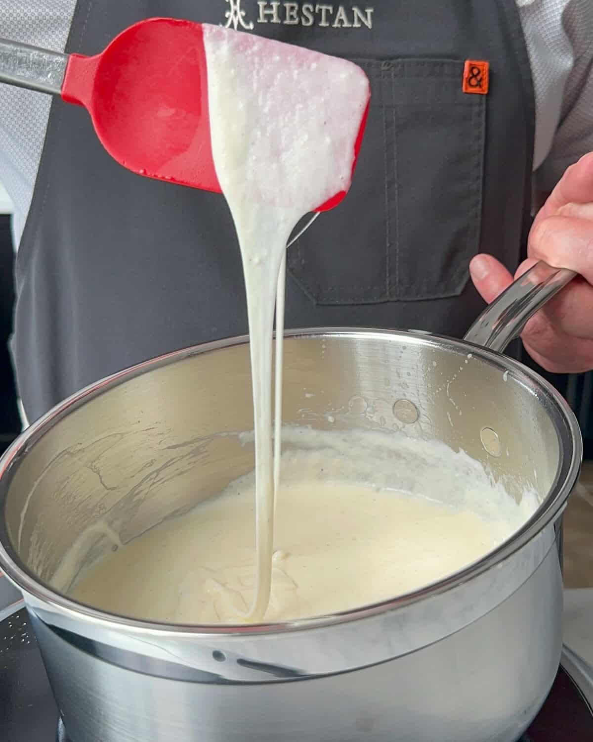Stir the Oaxaca Fondue until the cheese is fully melted and smooth.