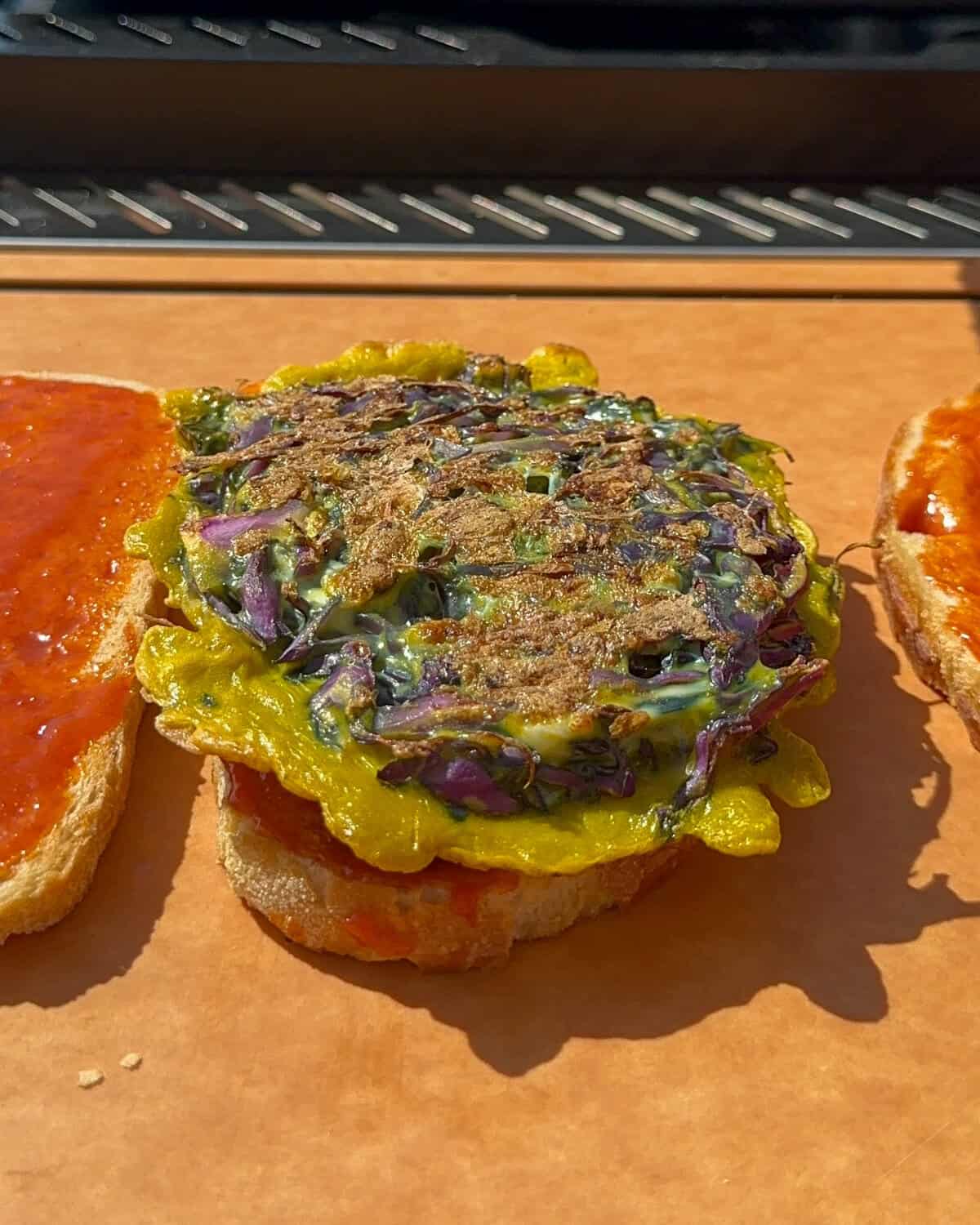 Assemble the Korean Street Toast - add the cabbage omelette