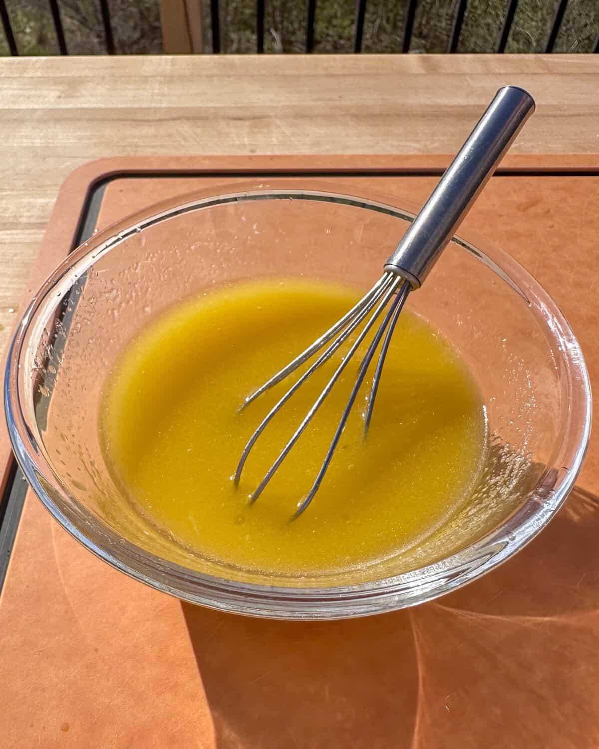 Whisk together the lime juice, ginger, honey, olive oil, and salt.