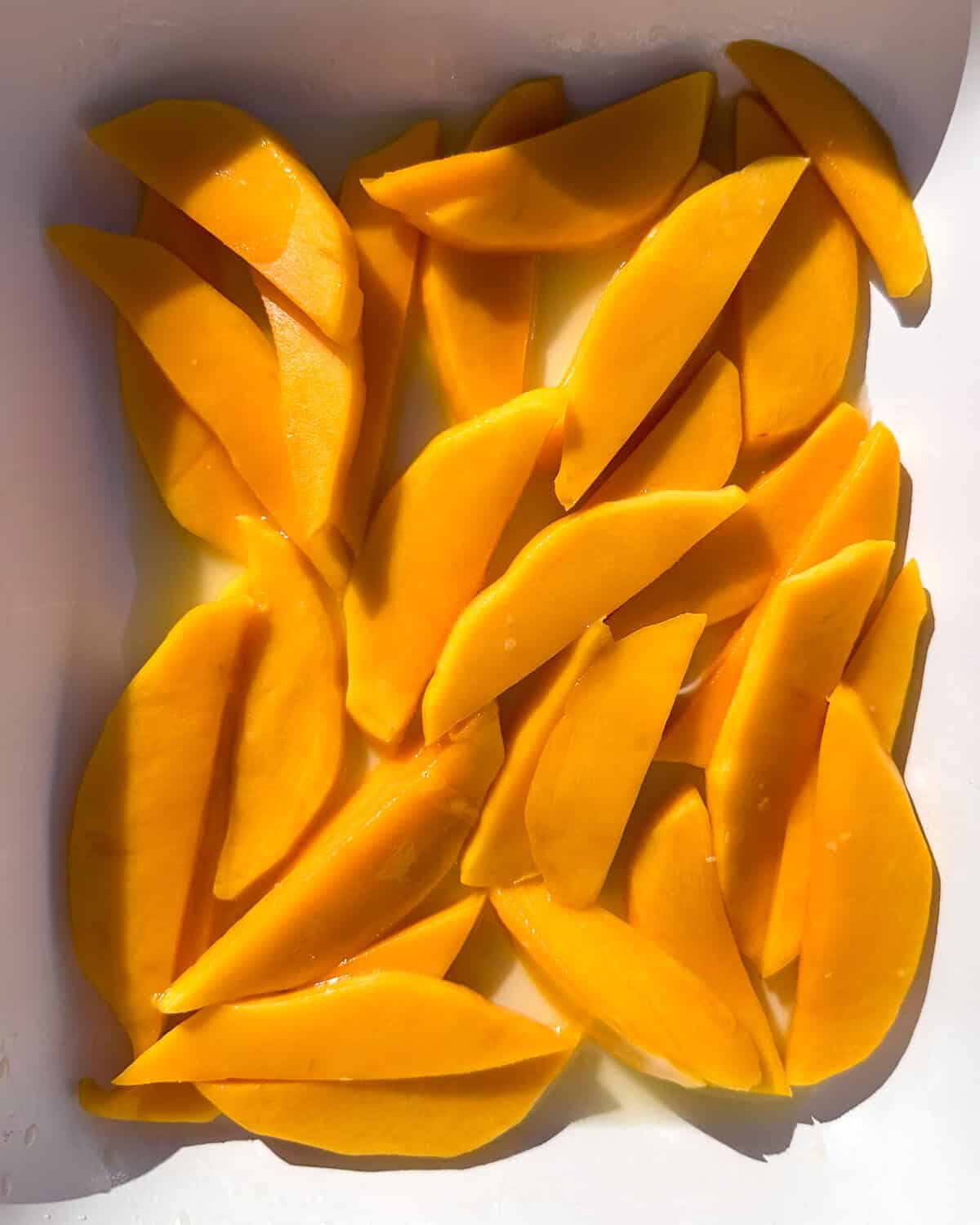 Mango strips tossed with olive oil, honey, lime juice, and a pinch of salt.