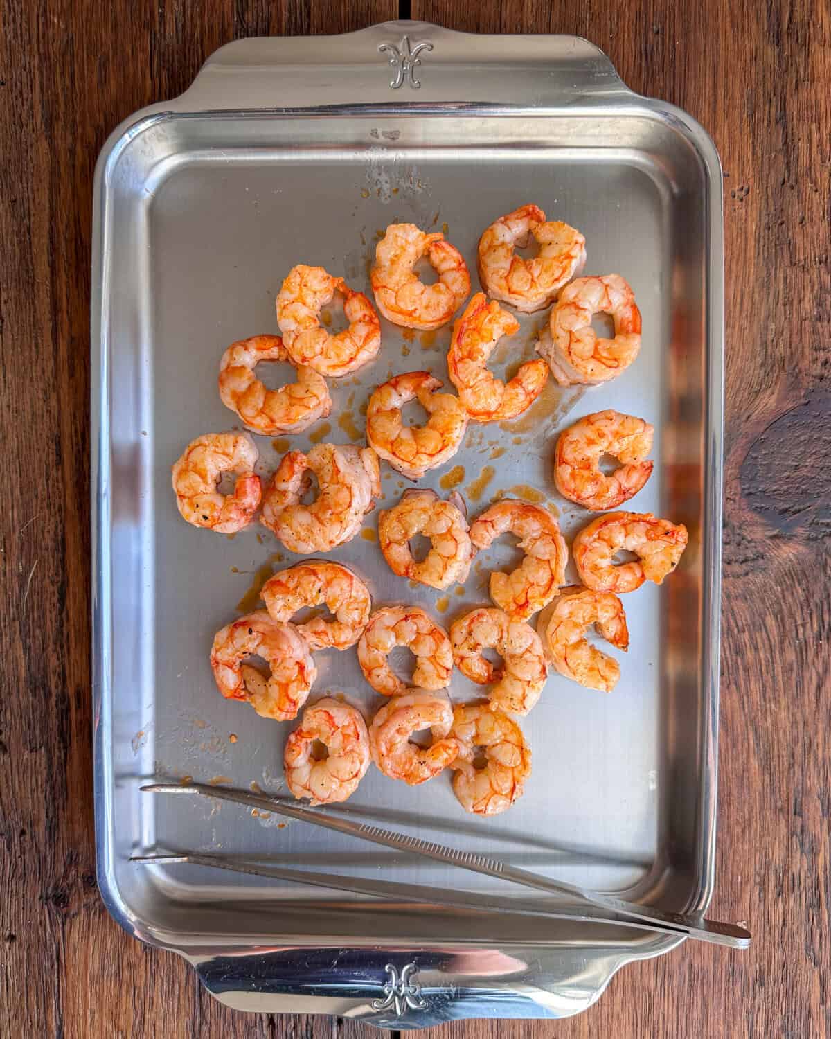 A tray of cooked shrimp for a shrimp panzanella recipe.