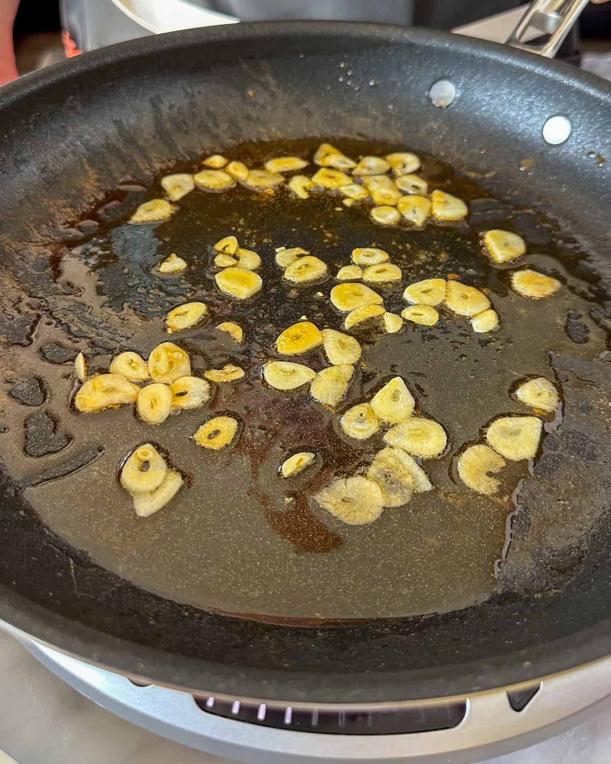 Sauté the sliced garlic until just fragrant.