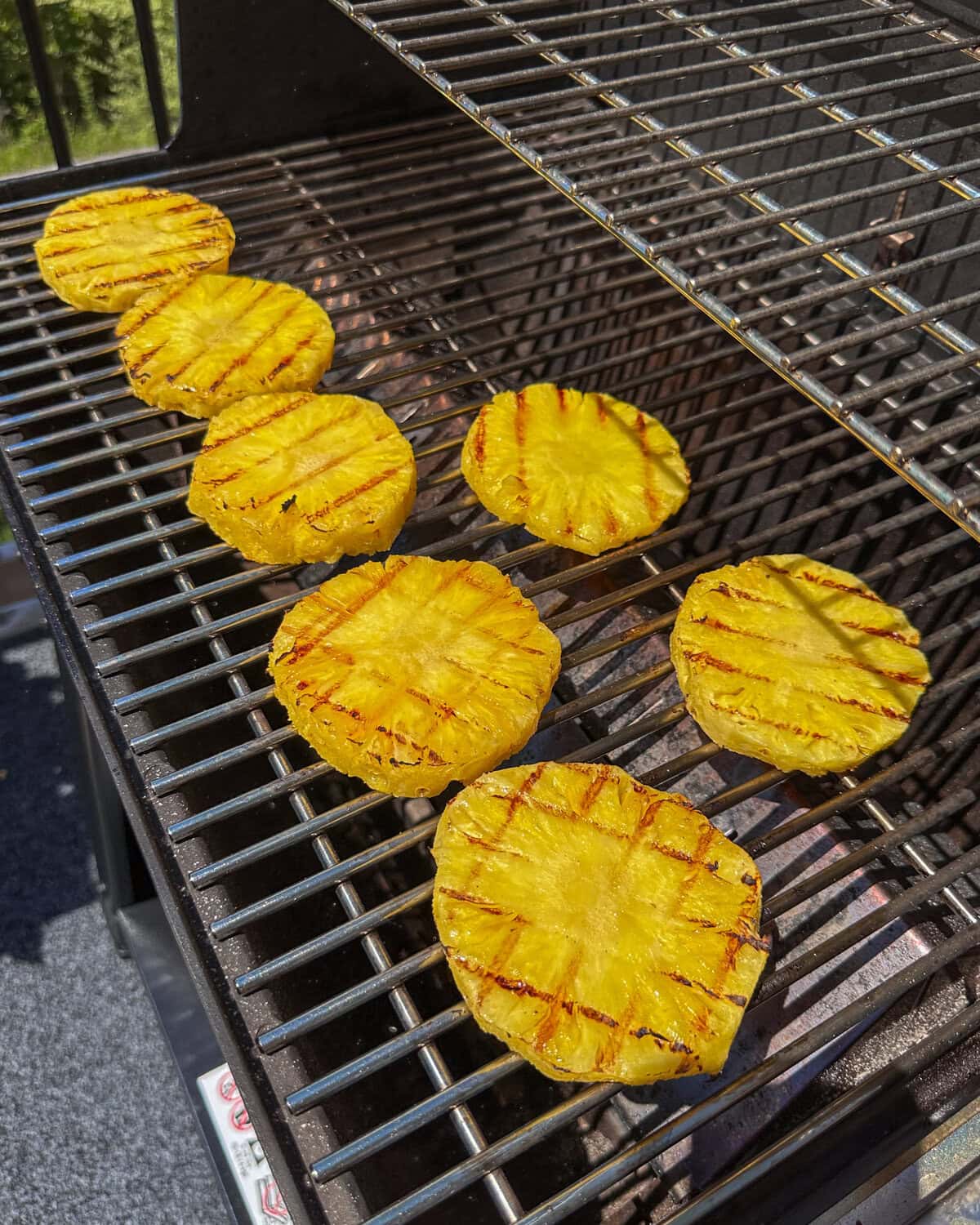 Pineapple rings with grill marks for a grilled pineapple relish recipe.