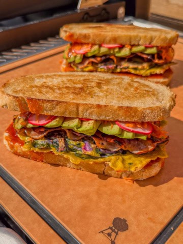 Two Korean Street Toast breakfast sandwiches with colourful ingredients.