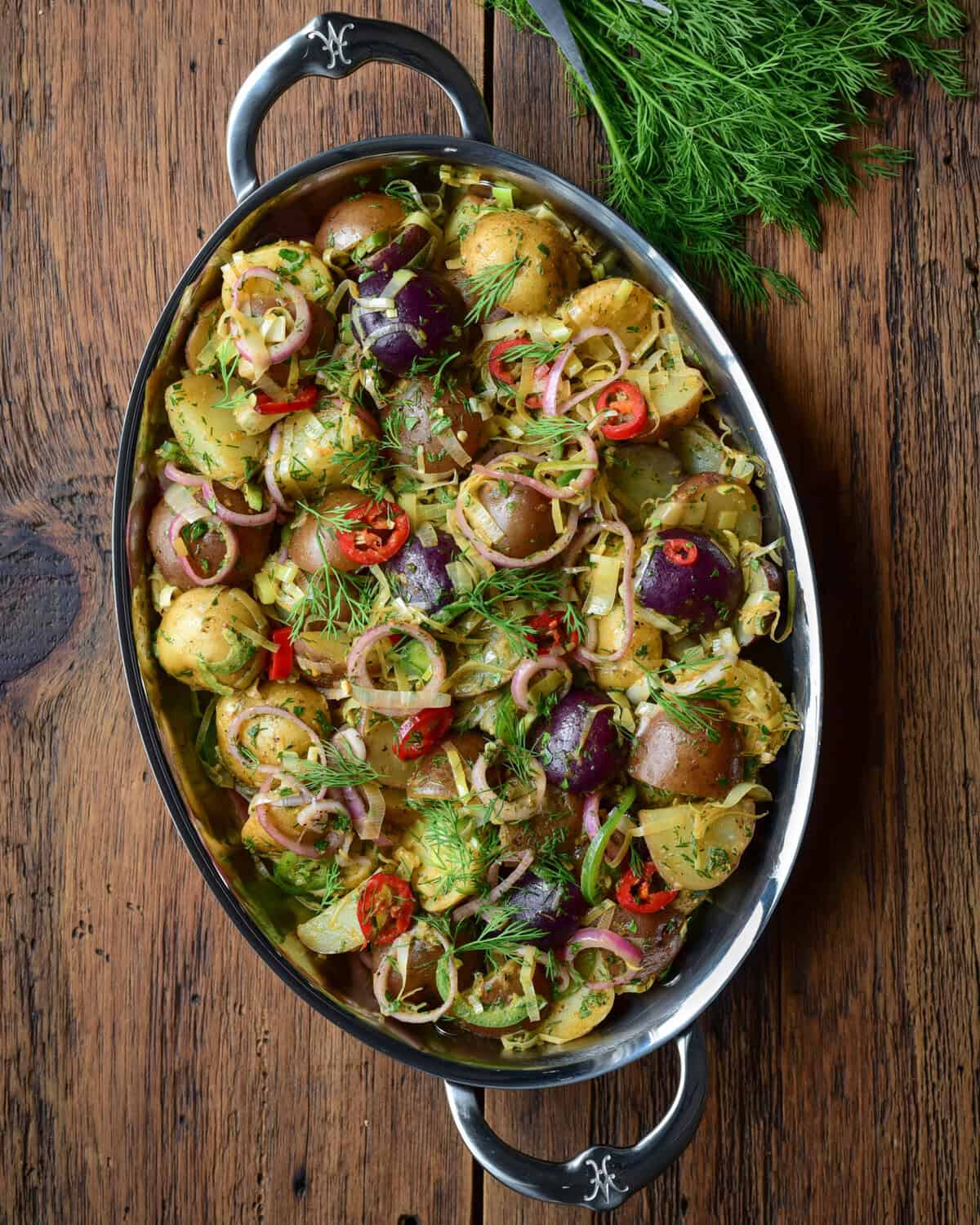 Brown Butter Potato Salad with Leeks & Pickled Shallots. Served with fresh dill.