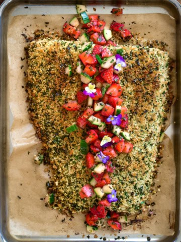 An Herb Crusted Salmon with Strawberry Mint Salsa  on a sheet pan.