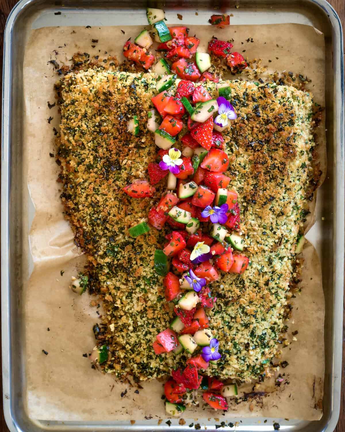 An Herb Crusted Salmon with Strawberry Mint Salsa on a sheet pan.
