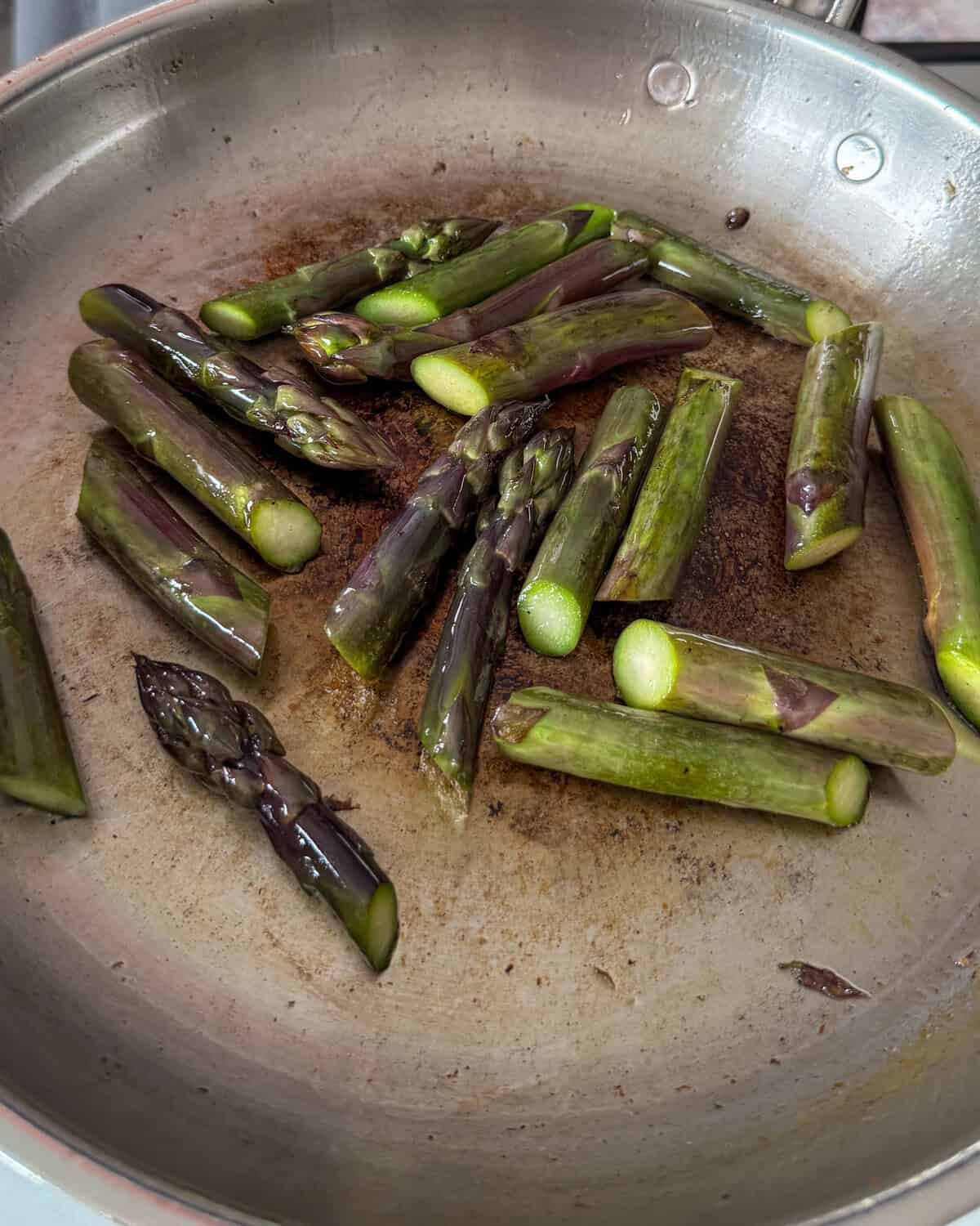 Seared asparagus for a charred corn salad recipe.