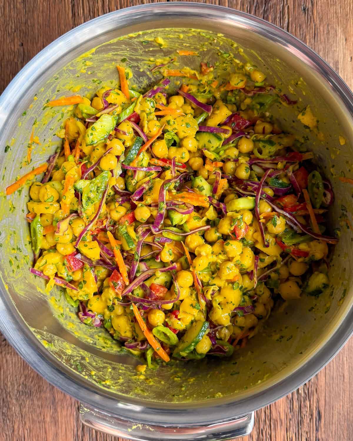 Stir in the cooled chickpeas into the salad bowl.