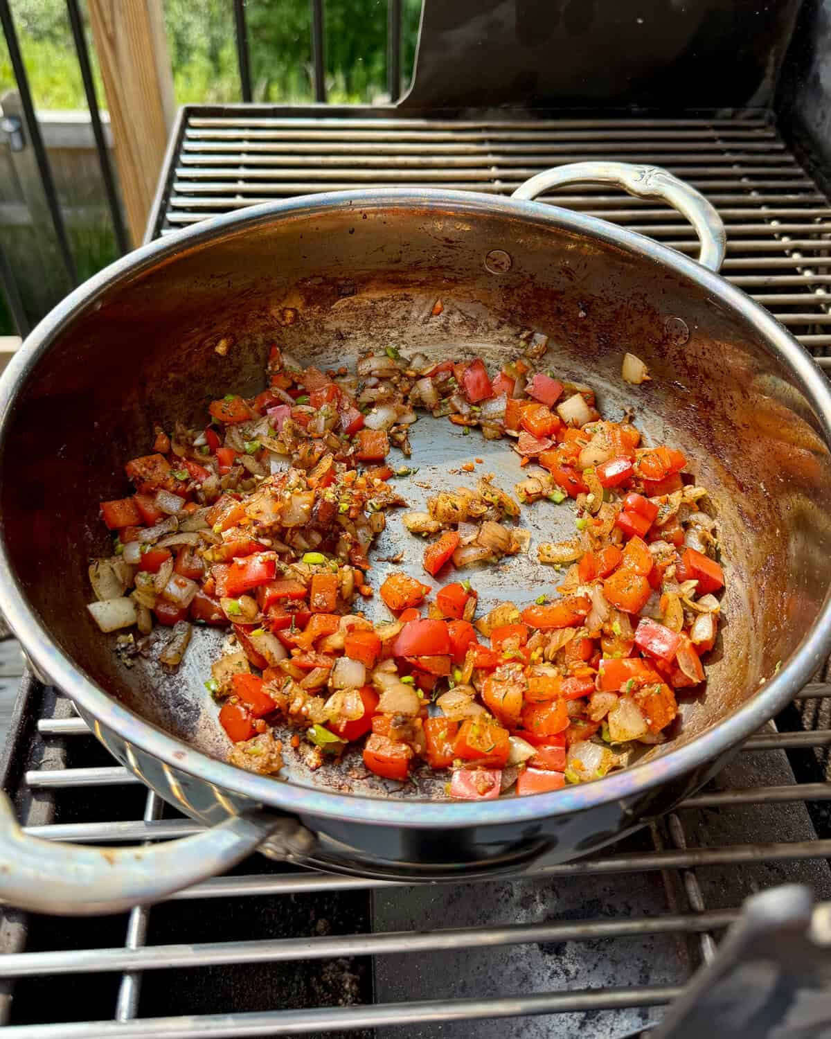 Saute the aromatics for Caribbean baked beans.