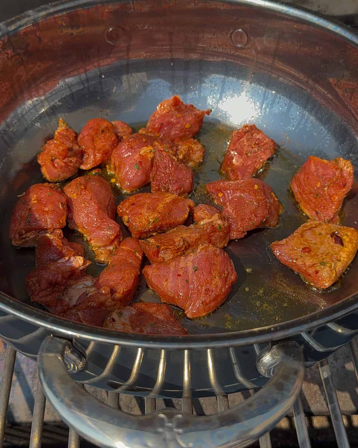 Sear the pork cubes in a dutch oven.