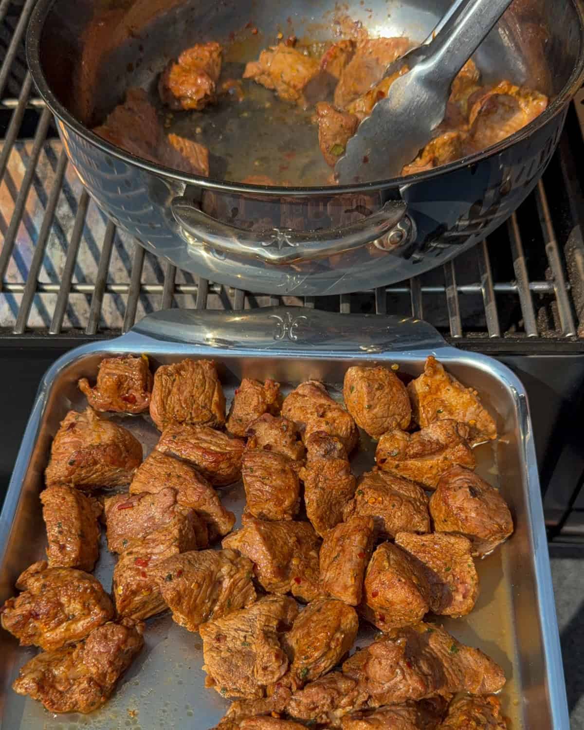 Transfer the seared jerk-spiced pork shoulder cubes to a tray.