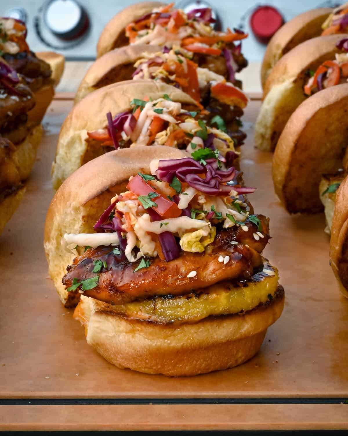 Chicken Teriyaki Sliders with Pickled Asian Slaw and grilled pineapple.