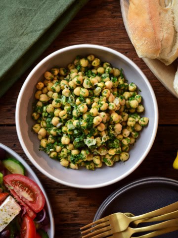 A bowl of chickpea parsley salad.
