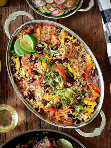 An oval platter of a Caribbean-Style Rice with Red Beans and Peppers.