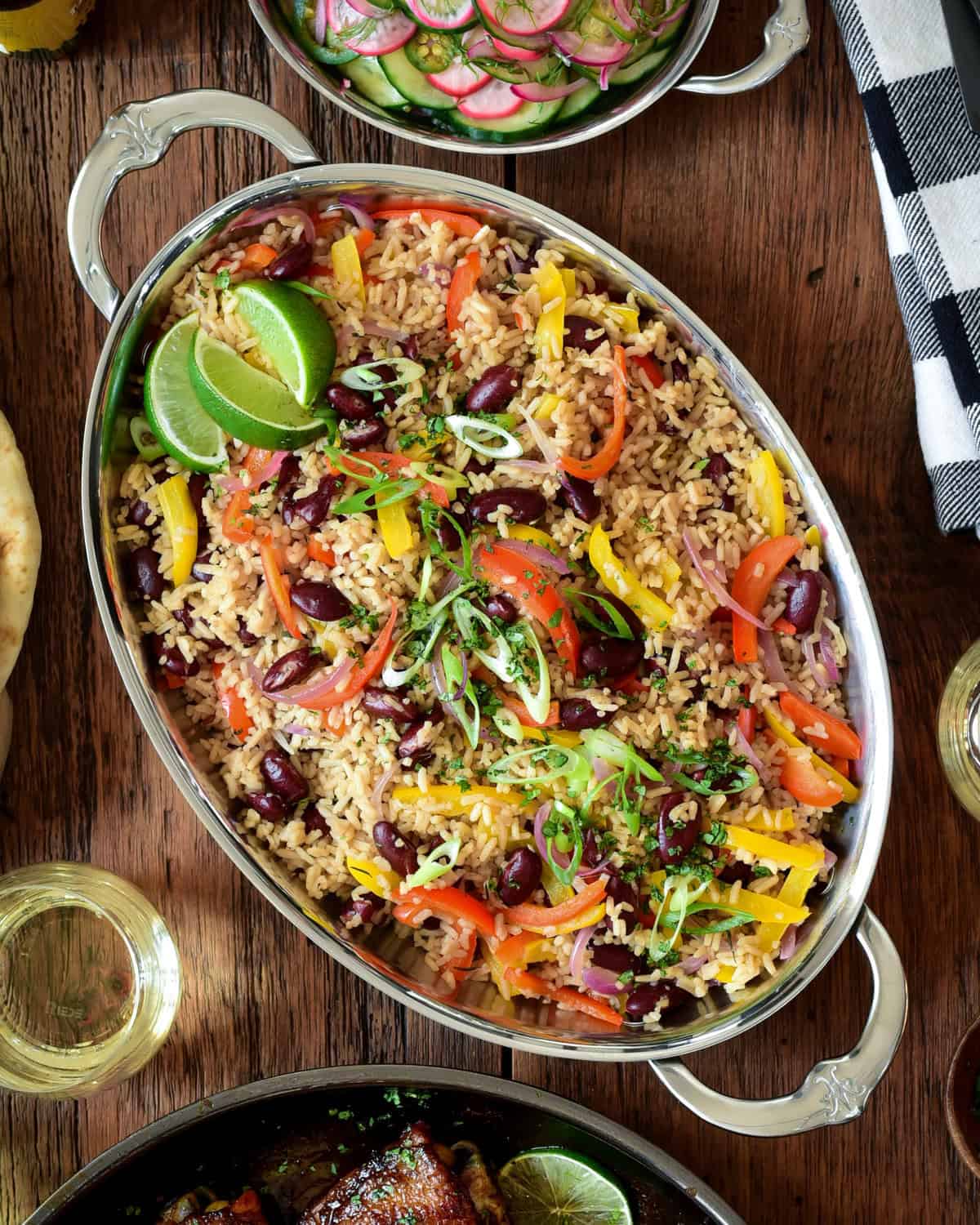 An oval platter of a Caribbean-Style Rice with Red Beans and Peppers.