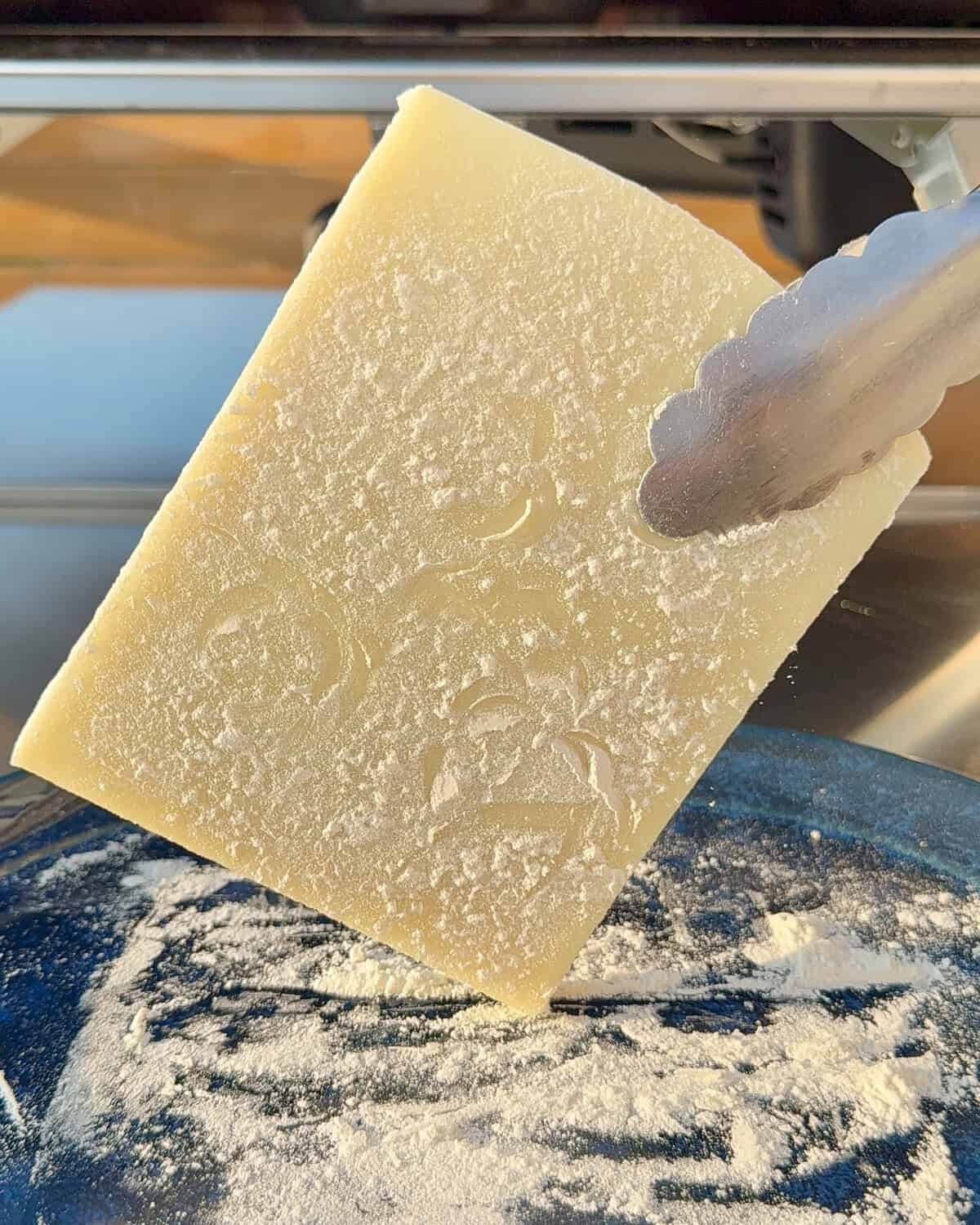 Lightly coat the Kefalotyri cheese with flour.