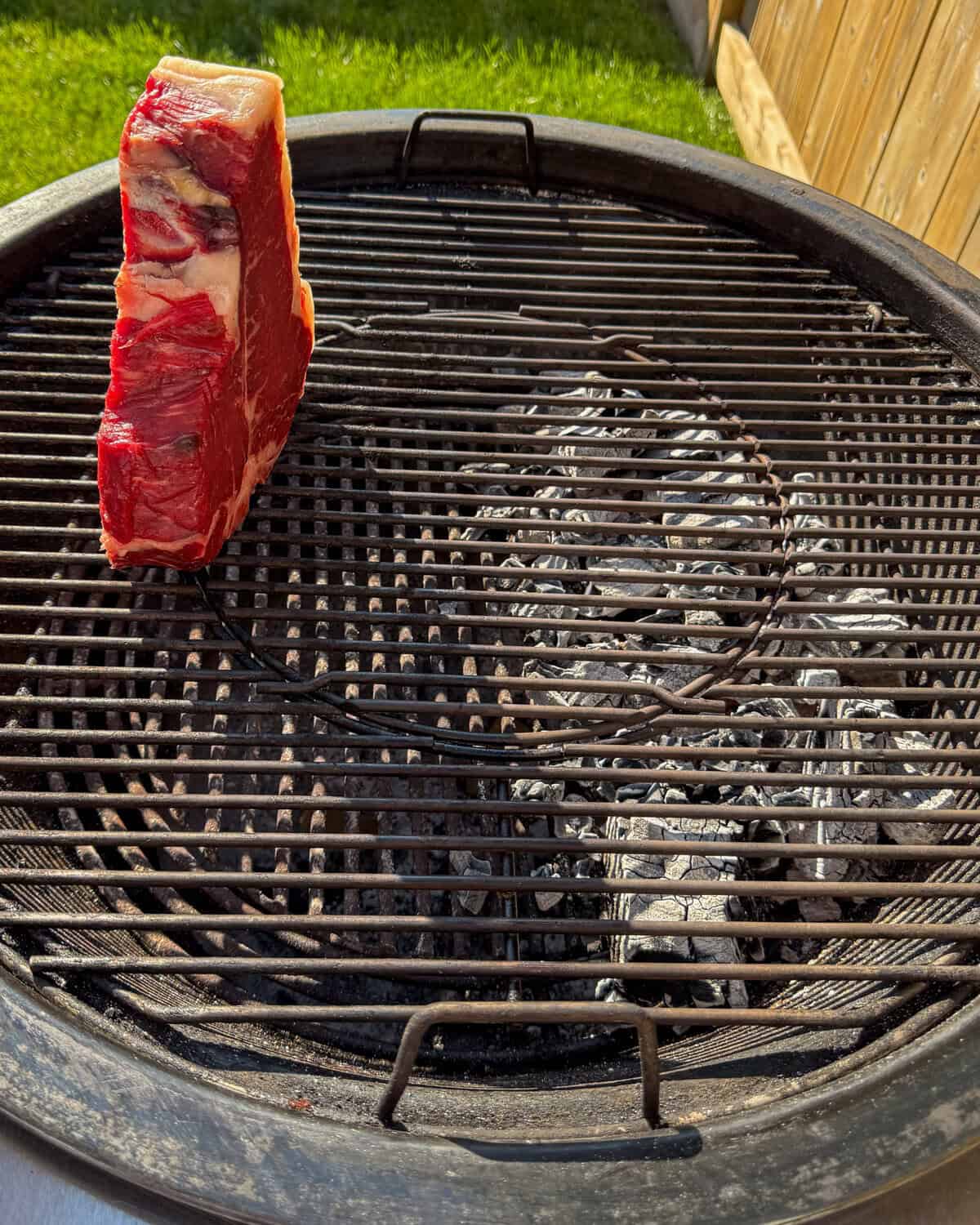 Place the steak on the indirect side of the grill.