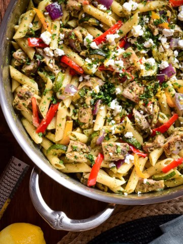 Zhoug Chicken Pasta Salad with Roasted Vegetables in a pot with a handle.