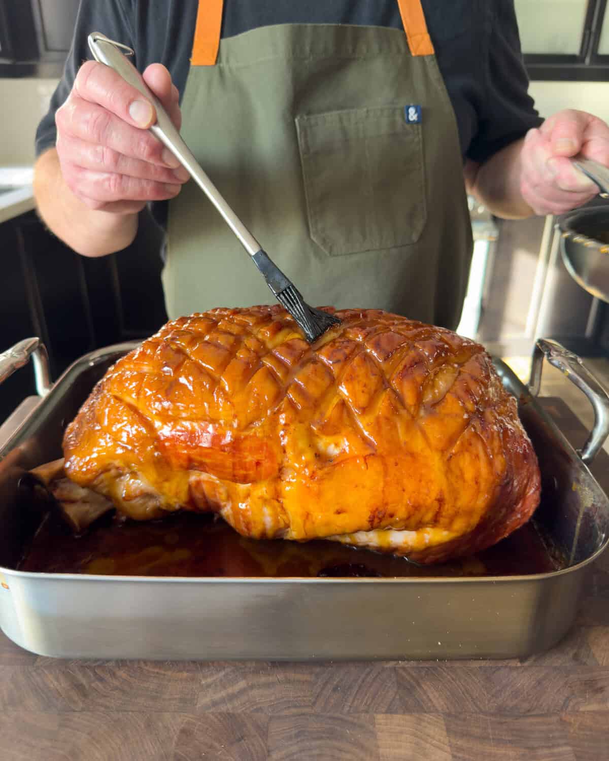 Glaze the holiday ham.