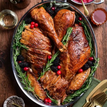 A festive sliced Tuscan turkey on a platter.