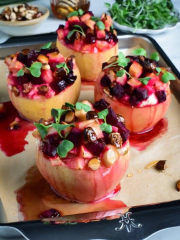Four savory baked apples topped with apples, beets and honey and stuffed with a ricotta-marscarpone filling.