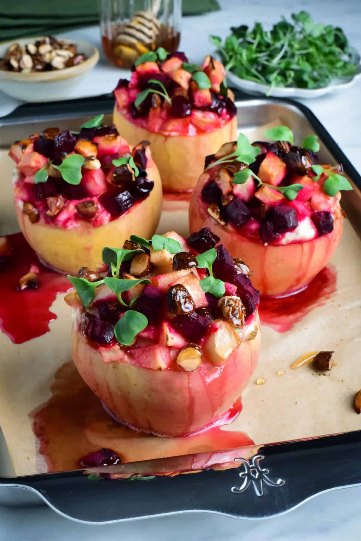 Four savory baked apples topped with apples, beets and honey and stuffed with a ricotta-marscarpone filling.