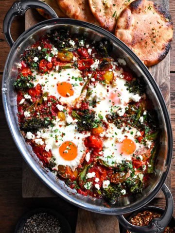 A Cherry Tomato & Broccolini Shakshuka with four eggs.
