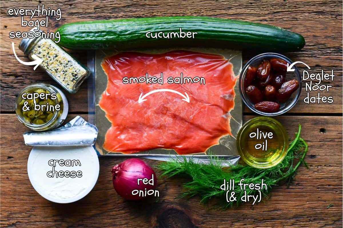 Appetizers with dates, cream cheese, salmon, onion, cucumbers and everything bagel seasoning.