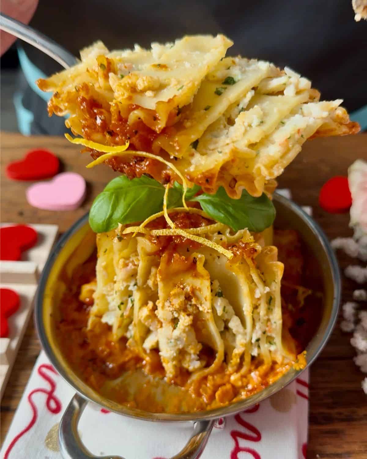 A cross-section of a seafood lasagna roll up, revealing the layers.